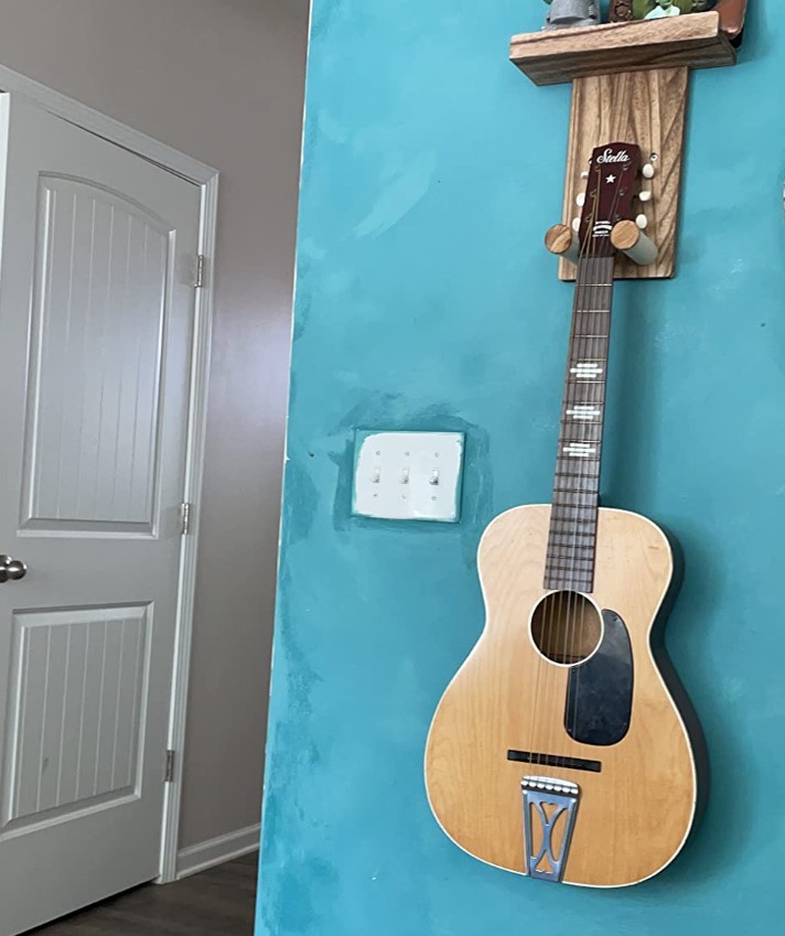 I found Keebofly Guitar Wall Mount best for your living room.
